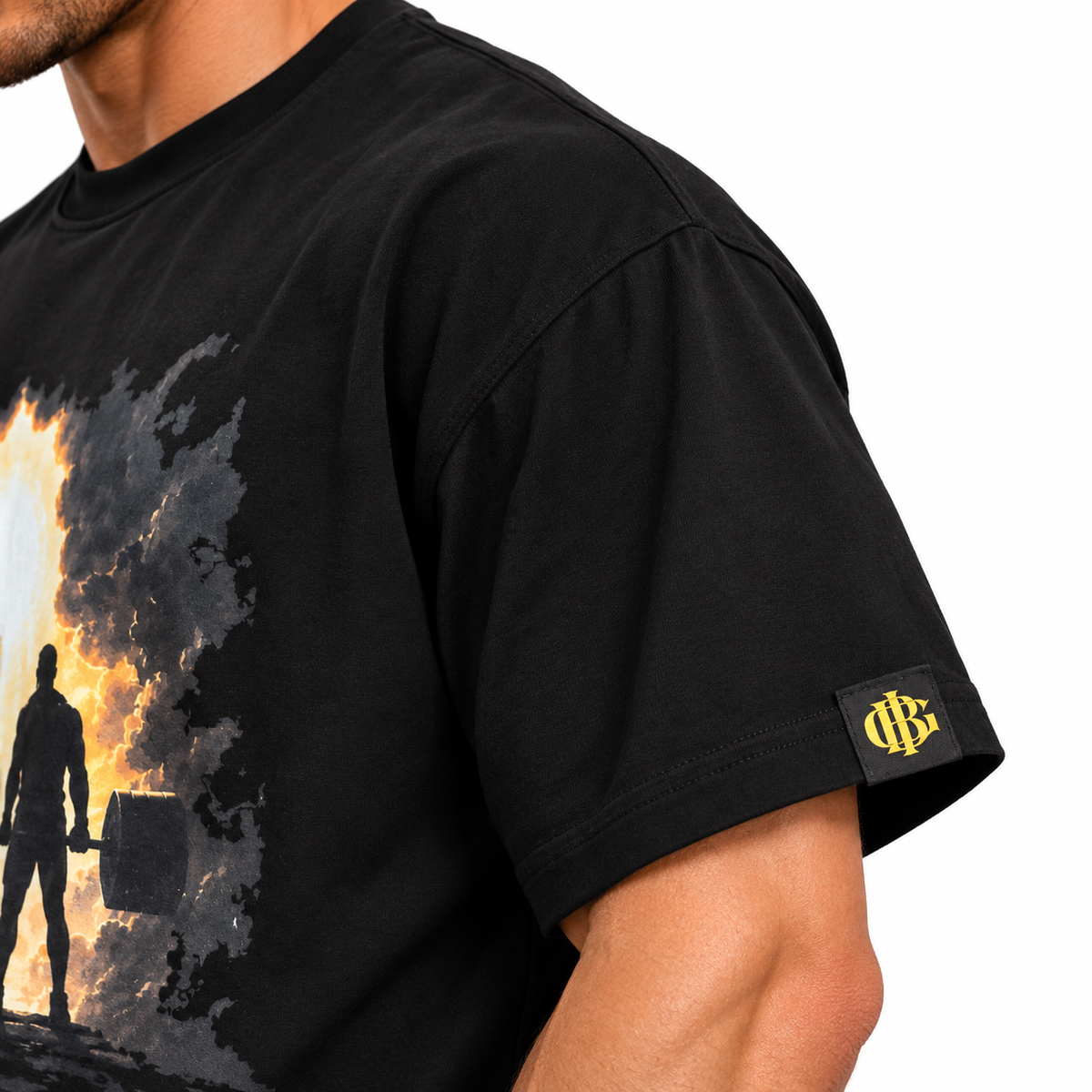 Woven gold BIG monogram sleeve tag on the BIG x TWL t-shirt